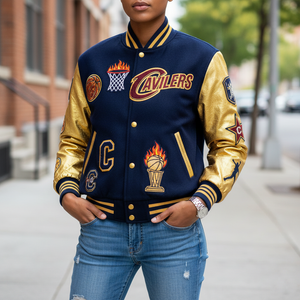 A woman wearing Cavs letterman jacket, standing in stylish pose