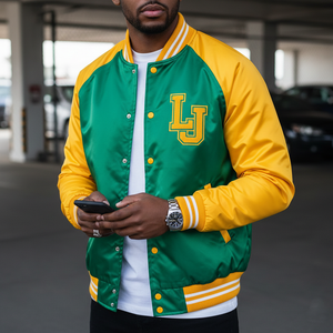 Person wearing a green and yellow letterman jacket with 'LJ' initials, standing in an indoor setting.