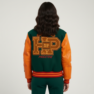 Person wearing a green and orange varsity jacket with 'HP Preston' on the back against a white background