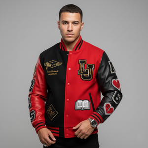 Man wearing a red and black varsity jacket with various designs on a gray background