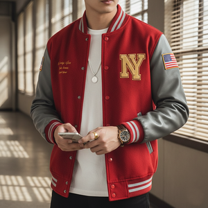 Person wearing a red and gray varsity jacket with a 'NY' logo, holding a phone.