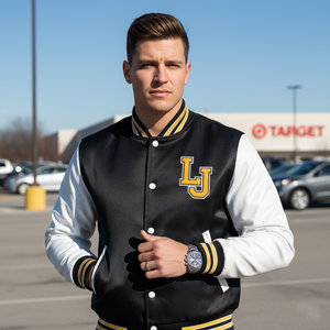 Man wearing a black and white letterman jacket with 'LJ' on it in a parking lot.
