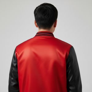 Person wearing a red and black jacket on a gray background