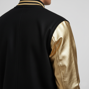 Black jacket with gold sleeves on a plain background