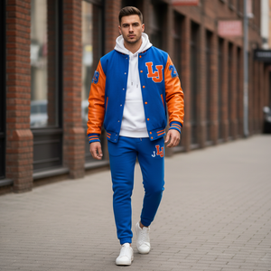 Man wearing a blue and orange letterman jacket with 'LJ' on a city street.
