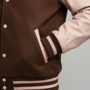 Brown varsity jacket with beige accents on a neutral background