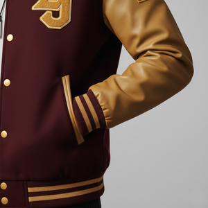 Side angle of burgundy varsity jacket highlighting gold leather sleeve construction and rib knit trim details