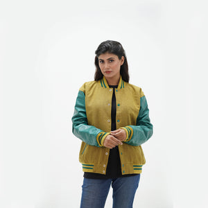 Full display of women's camel and green letterman jacket showing complete silhouette, ribbed waistband, and premium wool-leather combination