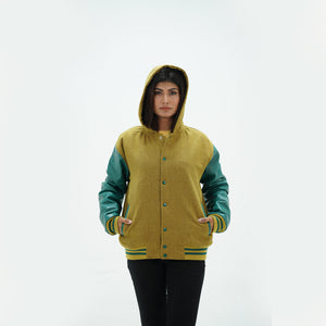 Detail shot of green leather sleeve with camel and white striped ribbed knit cuffs on women's hooded varsity jacket