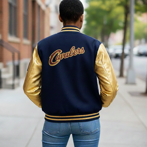 Back view of Cavs varsity jacket for women displaying burgundy Melton wool body, gold genuine leather sleeves, and ribbed waistband for basketball fans