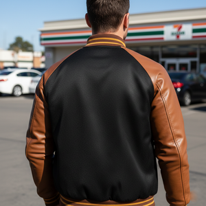 Person wearing a black and brown varsity jacket in front of a 7-Eleven store.