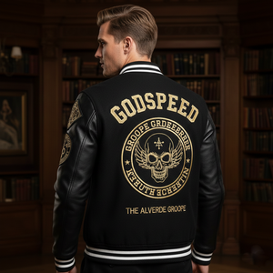 Person wearing a black jacket with gold text and designs in a room with bookshelves.
