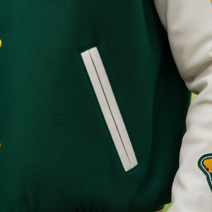Close-up of a green jacket with a white stripe and a beige sleeve with a logo.