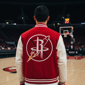Person wearing a red and white jacket with a logo on a basketball court
