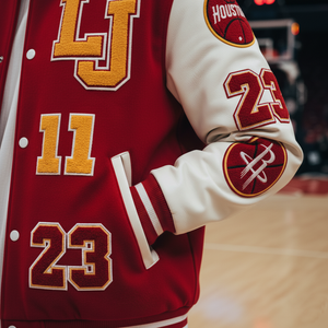 Red and white varsity jacket with numbers and logos on a blurred sports court background