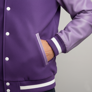 Purple varsity jacket with a clear pocket on a gray background