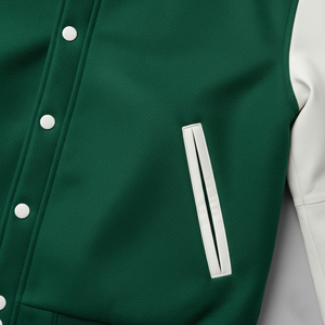 Close-up of a green jacket with white buttons and a white stripe on a light gray background