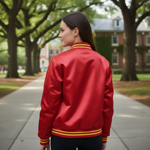 Back view of ladies varsity letterman jacket displaying red satin body, and ribbed waistband for cozy everyday outerwear