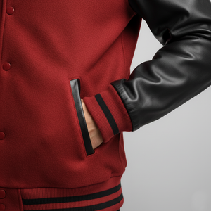 Red jacket with black leather sleeves on a gray background