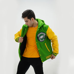 Detail shot of men Philadelphia Eagles letterman hoodie displaying genuine yellow leather sleeves and midnight green wool body craftsmanship