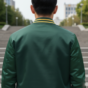 Person wearing a green jacket with a yellow stripe in an outdoor setting