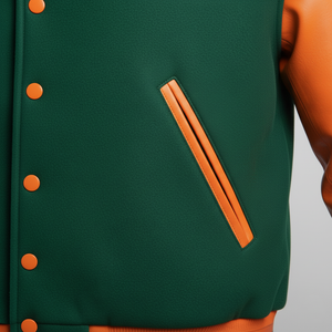 Green and orange varsity jacket with button details on a gray background