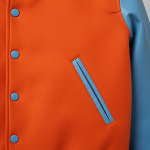 Close-up of an orange jacket with blue buttons and trim