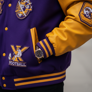 Purple and yellow varsity jacket with football-themed patches and a watch on the sleeve.
