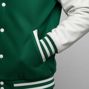 Green varsity jacket with white accents on a gray background