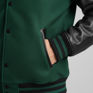 Green varsity jacket with black accents on a gray background