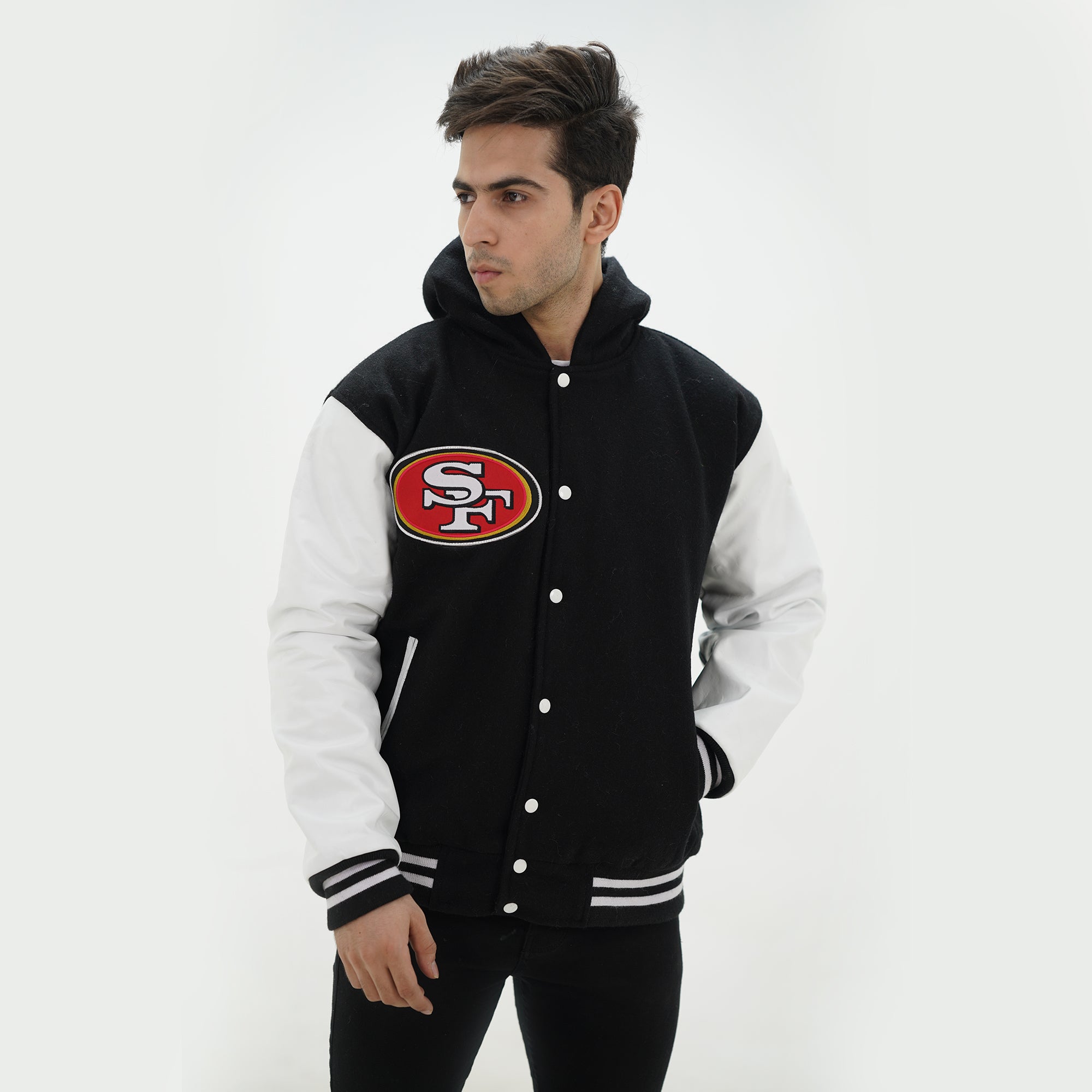 Side profile of San Francisco varsity hoodie showcasing white leather arms and black wool body with attached hood for fans