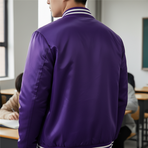 Person wearing a purple jacket in an indoor setting