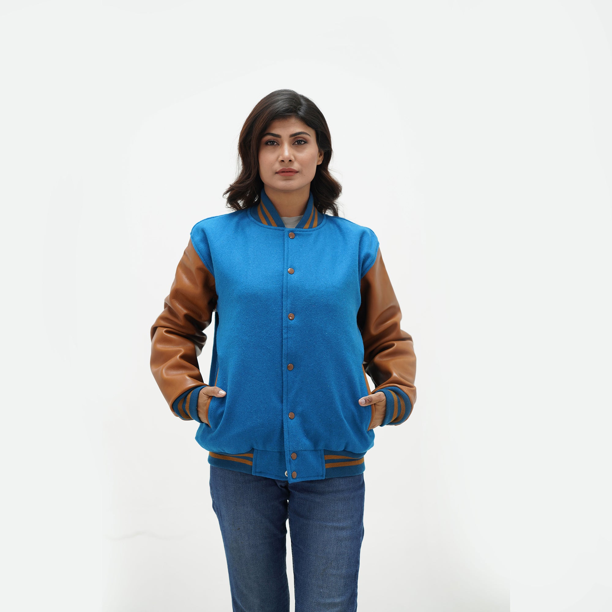 Sky blue letterman jacket women three-quarter view - showcasing feminine fit with brown leather arms and coordinating ribbed trim