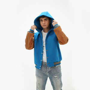 Side angle of men's sky blue varsity jacket over hoodie highlighting genuine cowhide leather sleeves and cotton rib trim