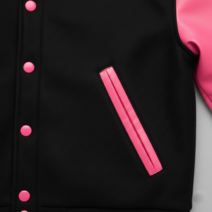Black jacket with pink buttons and a pink patch on a light gray background