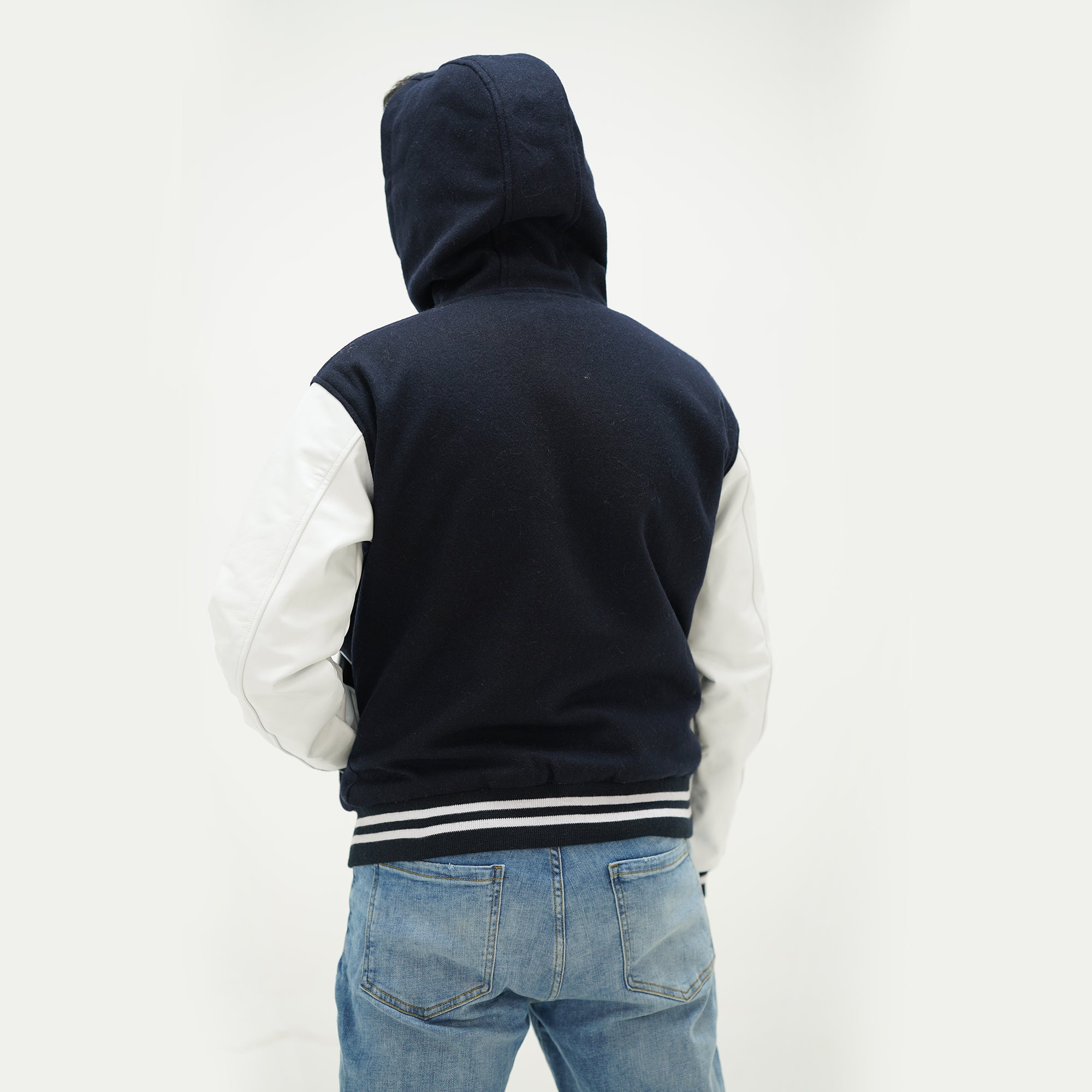 Back view of dark blue and white varsity jacket with hood wool body showing premium quality construction