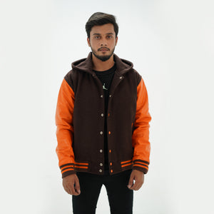 Detailed view of varsity jacket with hoodie leather arms and ribbed trim premium construction