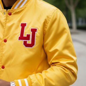 Close-up of varsity letterman bomber jacket LJ logo embroidery and premium quality stitching details