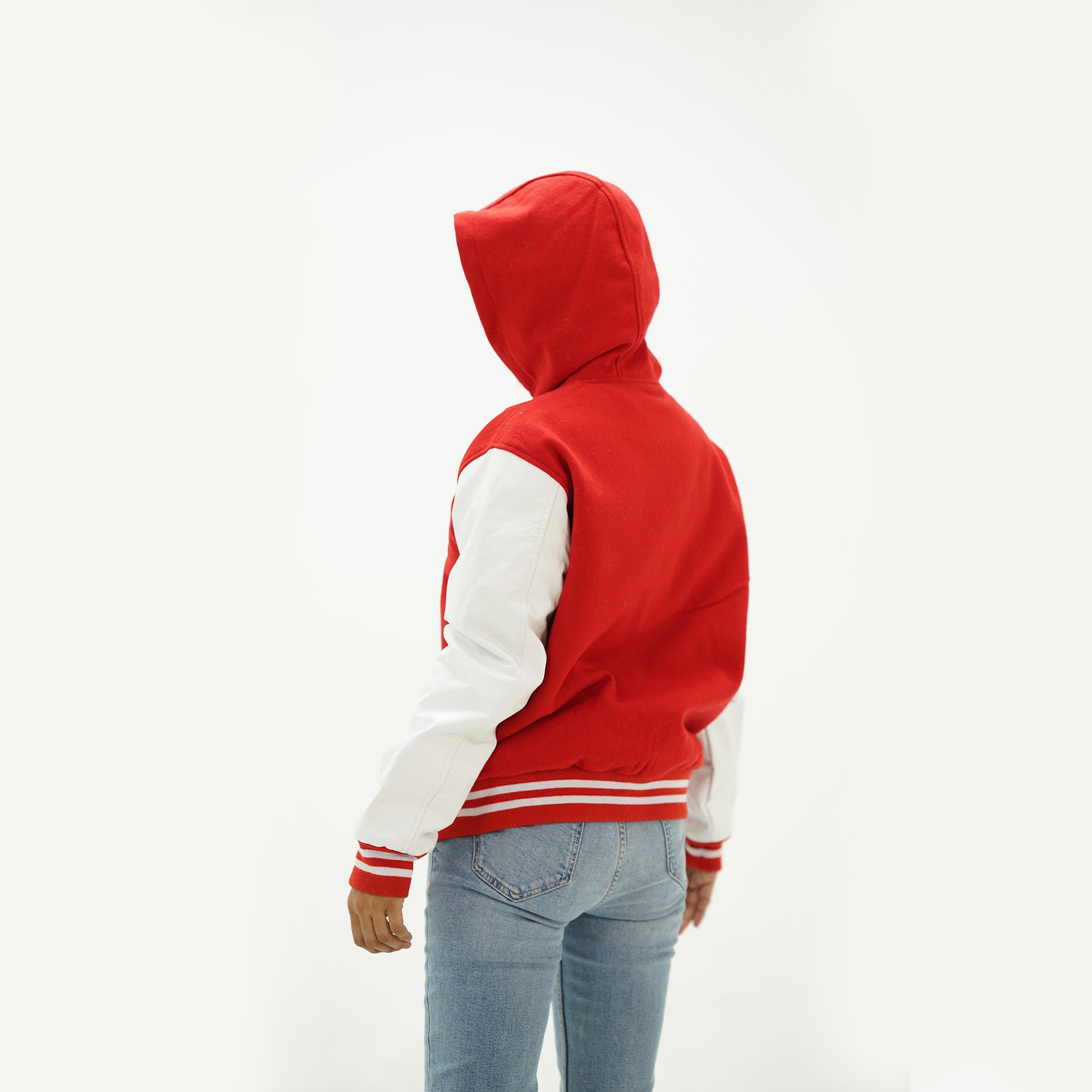 White and red letterman jacket back view showing wool body construction and ribbed waistband detail