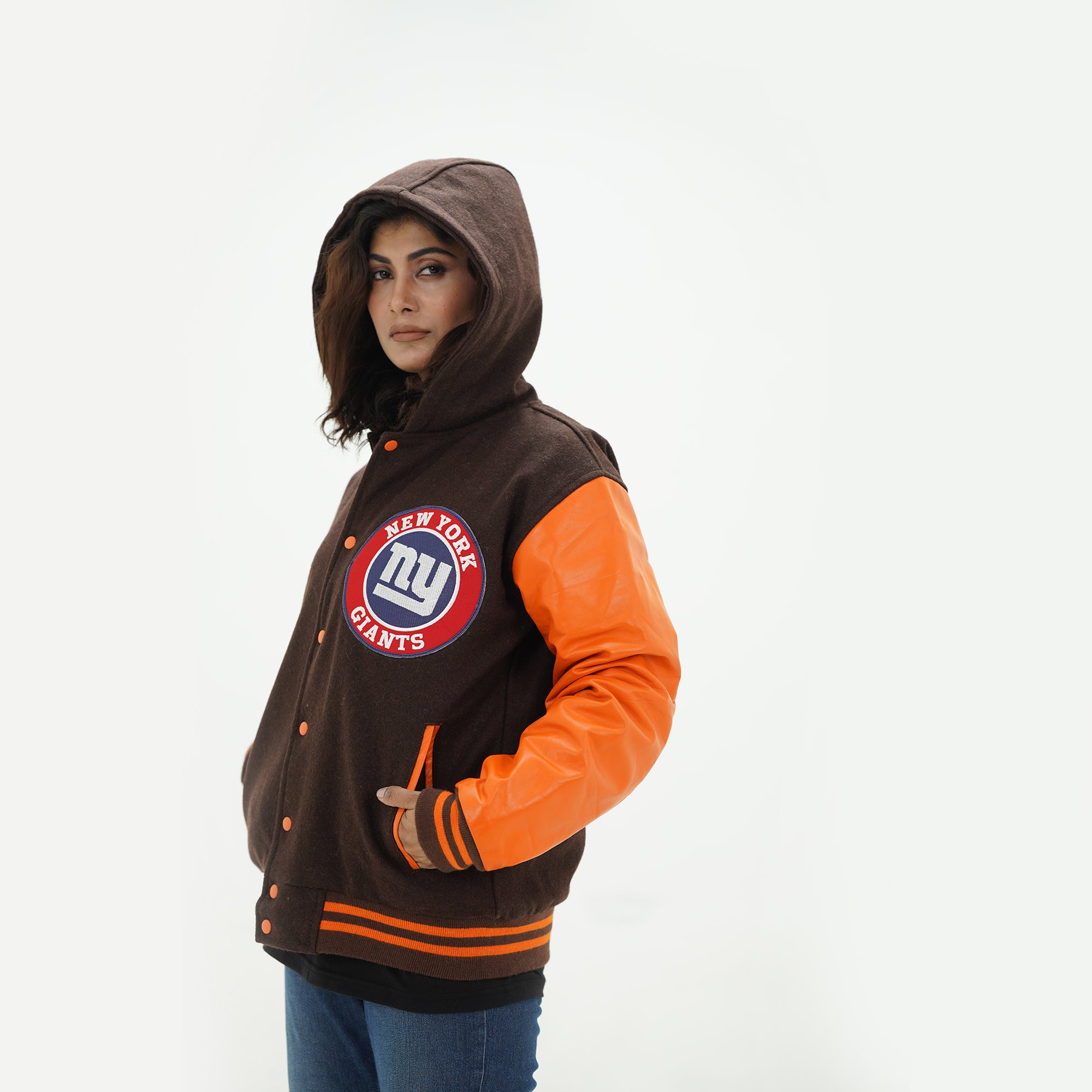 Side angle of women New York Giants hoodie jacket showcasing hood styling with brown wool body and old gold leather arms for ladies