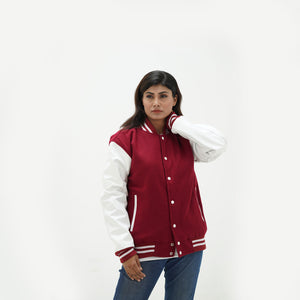 Women's magenta and white varsity jacket - displaying vibrant magenta wool body with white leather sleeves and ribbed hem detail