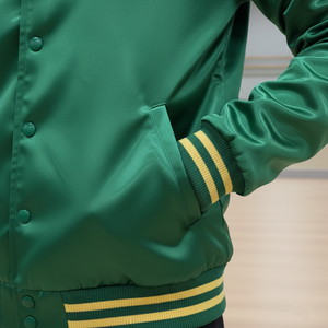 Green jacket with yellow stripes on cuffs and hem, blurred background
