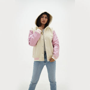 Close-up of adjustable drawstring hood on women's black varsity jacket with white striped rib knit trim