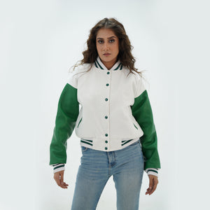 Three-quarter angle of women's white and green varsity jacket highlighting snap buttons, side pockets, and fresh white-green color scheme