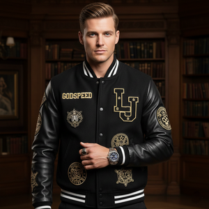 Man wearing a black varsity jacket with gold embroidery in a library setting