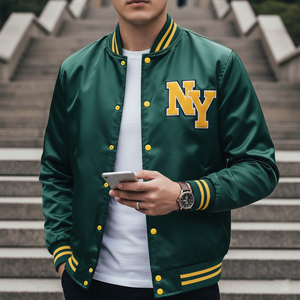 Person wearing a green varsity jacket with 'NY' on it, standing on steps.