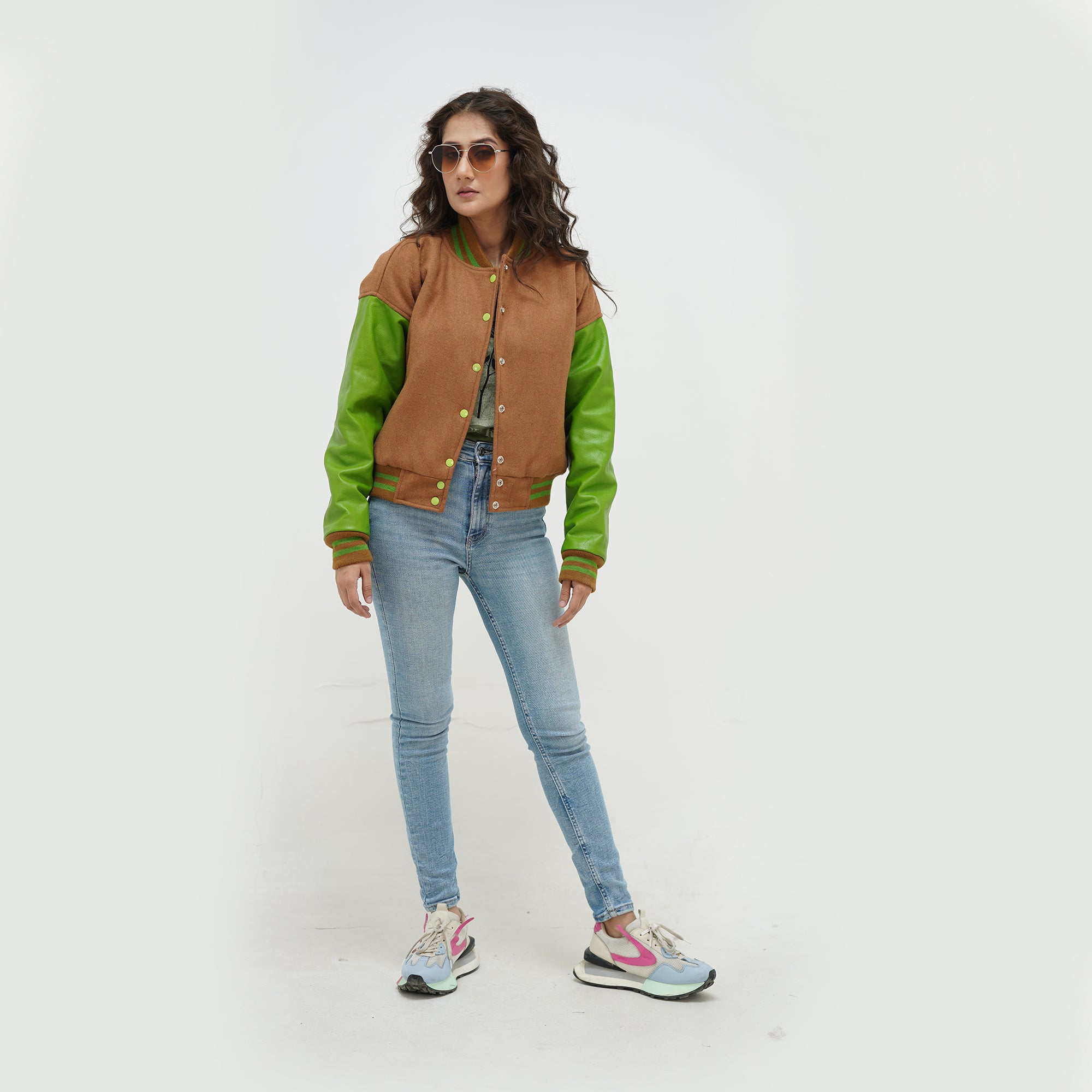 Full display of brown and parrot green letterman jacket for women showing complete fit, premium wool-leather construction, and earthy brown-vibrant green styling