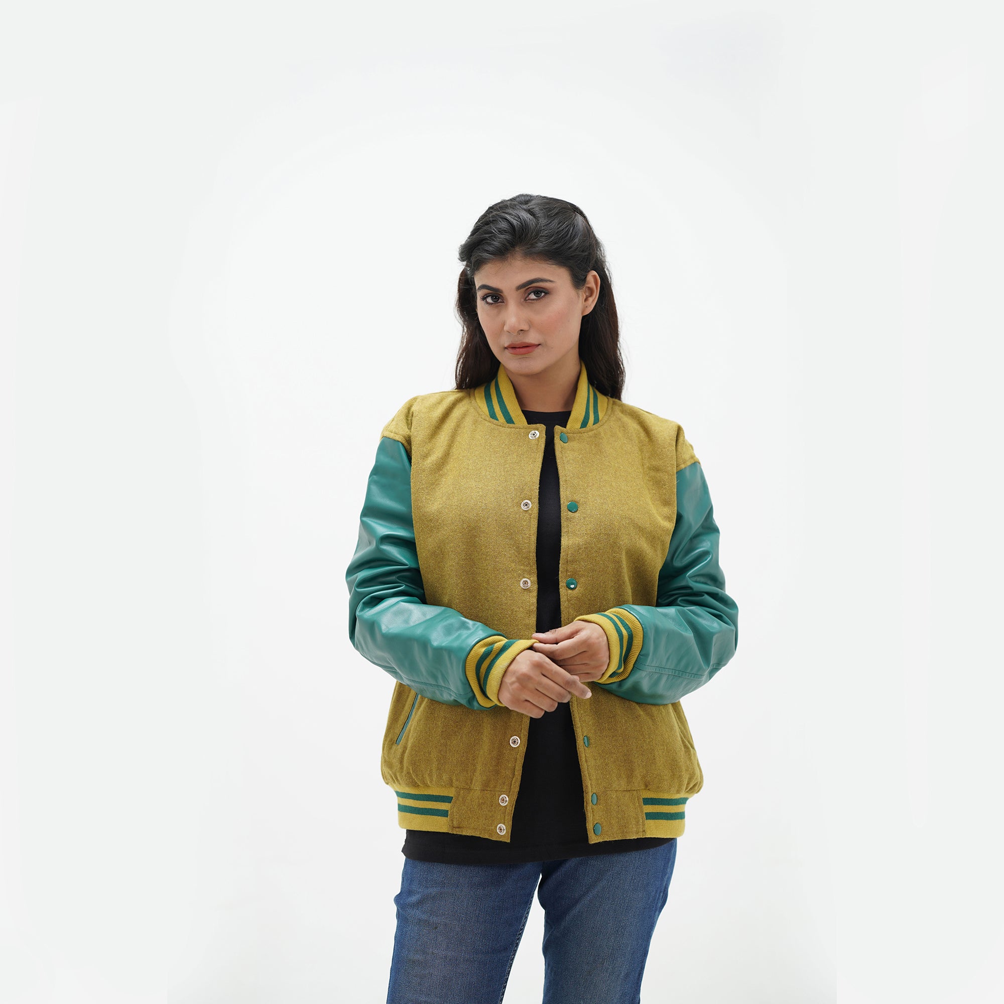 Full display of women's camel and green letterman jacket showing complete silhouette, ribbed waistband, and premium wool-leather combination