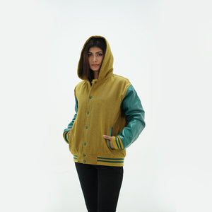 Side profile of camel women's varsity hoodie featuring green leather raglan sleeves and striped ribbed cuffs with integrated hood
