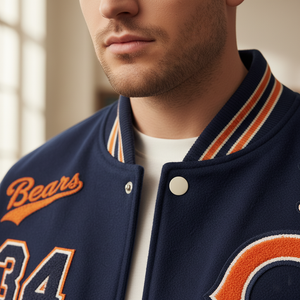 Man wearing a navy blue letterman jacket with 'Bears' and number '34' on it.